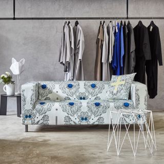Toying with symmetry and floral motifs combined with simple graphic patterns, the Azami sofa slipcover accommodates all...
